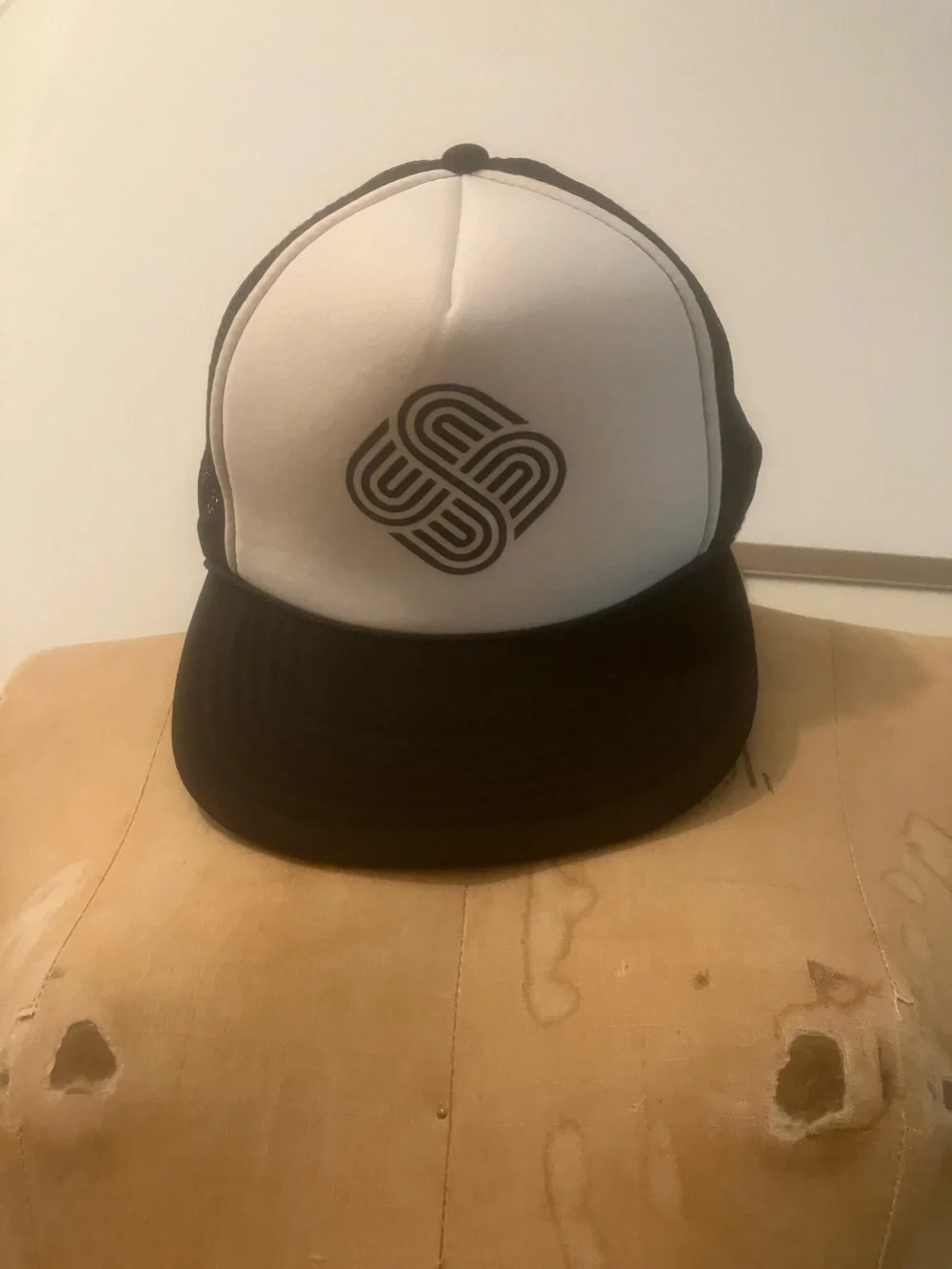 Black & White Trucker Hat with Geometric Emblem